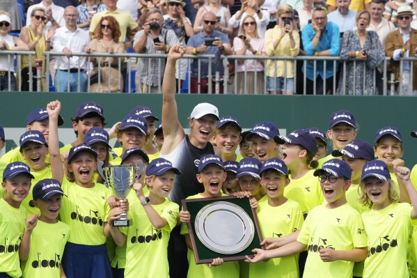 Poland's Iga Swiatek celebrates her victory with young fans after winning the final match at the WTA250 Poland Open tennis tournament In Warsaw, Poland, Sunday, July 30, 2023.(AP Photo/Czarek Sokolowski)