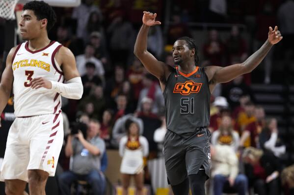 Oklahoma State guard John-Michael Wright (51) celebrates in front of Iowa State guard Tamin Lipsey (3) at the end of an NCAA college basketball game, Saturday, Feb. 11, 2023, in Ames, Iowa. Oklahoma State 64-56. (AP Photo/Charlie Neibergall)