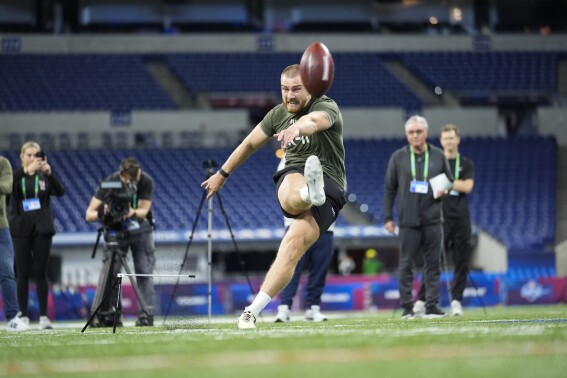 FILE - Kicker Mark Jackson of Ireland runs a drill at the NFL football scouting combine, Sunday, March 3, 2024, in Indianapolis. Ireland has become part of the NFL’s international playbook as Irish interest in the sport increases. Dublin is under review to potentially join the league’s growing list of international cities hosting a regular-season game. (AP Photo/Michael Conroy, File)