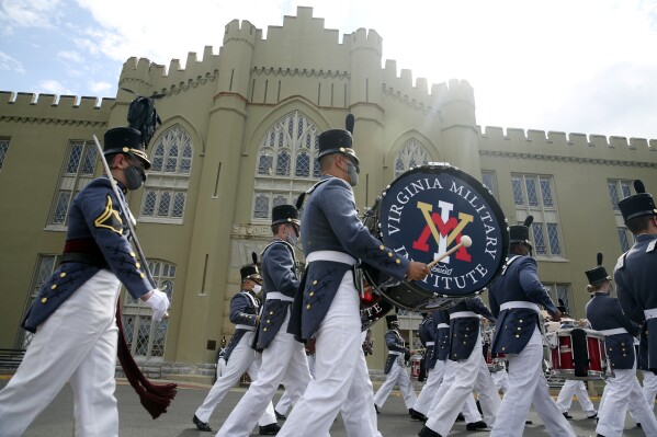 FILE - Virginia Military Cadets leave the barracks while participating in the annual end of the year parade on Friday, May 14, 2021 in Lexington, Va. A prospective student claims in a lawsuit filed Thursday, Sept. 14, 2023, that a Virginia Military Institute cadet sexually assaulted her during a 2021 overnight open house.(Heather Rosseau/The Roanoke Times via AP, File)