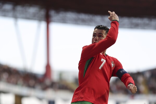 Portugal's Cristiano Ronaldo celebrates after scoring against Ireland during a friendly soccer match between Portugal and Ireland at the Aveiro Municipal stadium in Aveiro, Portugal, Tuesday, June 11, 2024. (AP Photo/Luis Vieira)