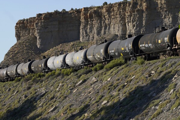 A train transports freight on a common carrier line near Price, Utah, July 13, 2023. (AP Photo/Rick Bowmer, File)