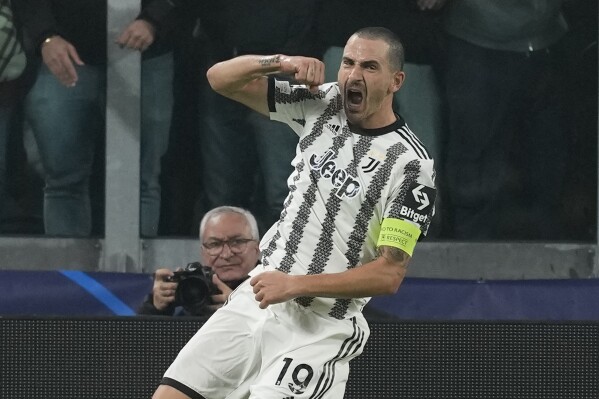 FILE - Juventus' Leonardo Bonucci celebrates after scoring his side's opening goal during the Champions League group H soccer match between Juventus and Paris Saint Germain at the Allianz stadium in Turin, Italy, Wednesday, Nov. 2, 2022. Italy captain Leonardo Bonucci’s potential move to Union Berlin and Bayern Munich’s search for a defensive midfielder are among the outstanding matters to be cleared up on the final day of the transfer window in Germany. (AP Photo/Antonio Calanni, File)