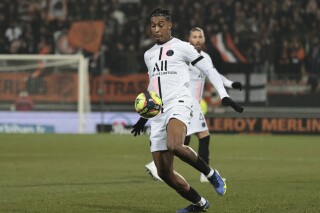 FILE - PSG's Presnel Kimpembe controls the ball during the French League One soccer match between FC Lorient and Paris Saint-Germain at the Moustoir stadium in Lorient, western France, on Dec. 22, 2021. Central defender Presnel Kimpembe has signed a two-year contract extension with Paris Saint-Germain to 2026. (AP Photo/Jeremias Gonzalez, File)