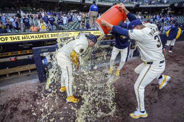 Milwaukee Brewers' Willy Adames gets doused after a win over the Tampa Bay Rays in a baseball game Wednesday May 1, 2024, in Milwaukee. (AP Photo/Kenny Yoo)