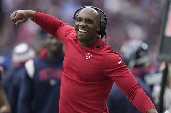 Houston Texans head coach DeMeco Ryans celebrates on the sideline during the first half of an NFL football game against the Tennessee Titans, Sunday, Dec. 31, 2023, in Houston. (AP Photo/Eric Christian Smith)