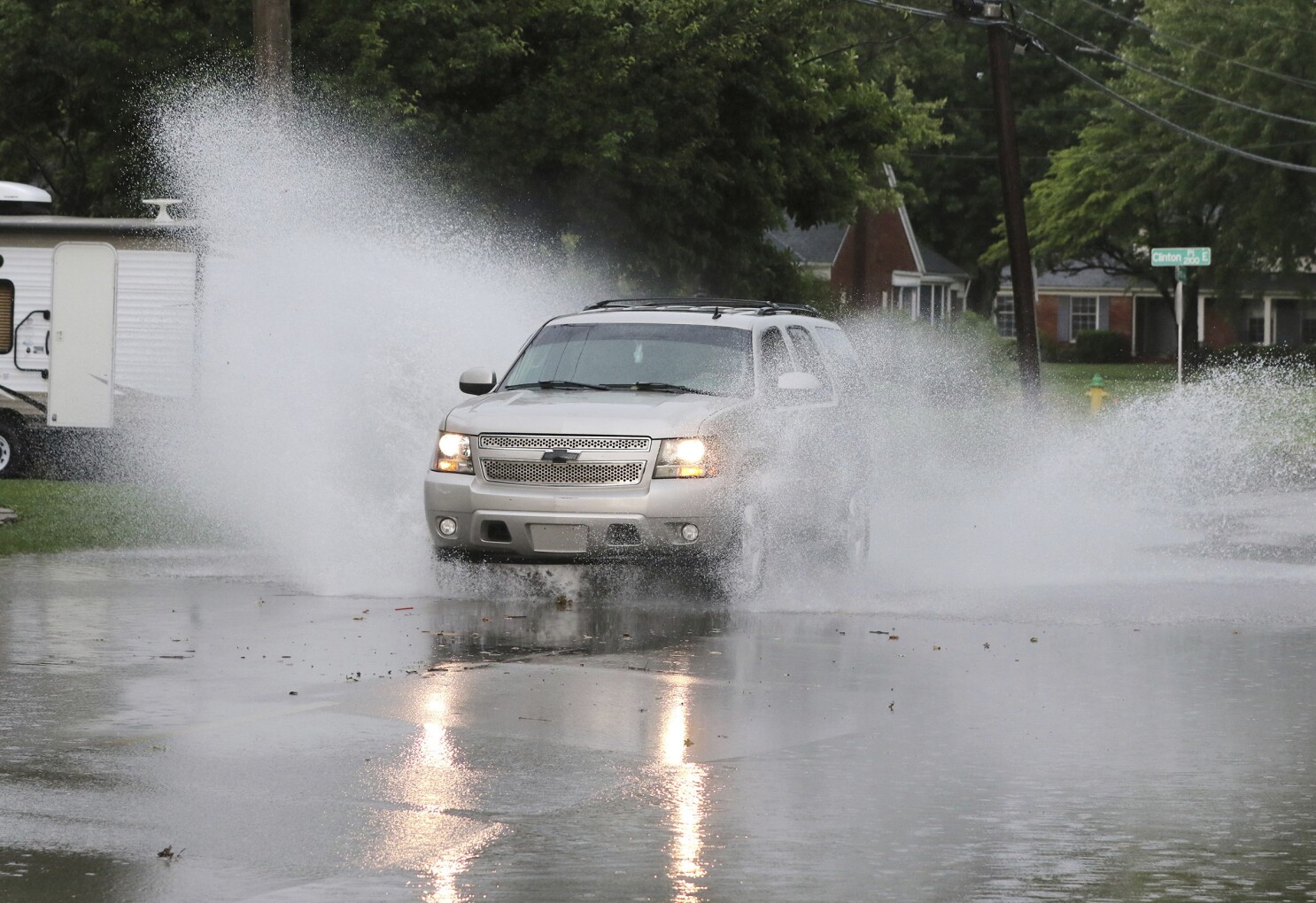 Storms push through the South, killing at least 2 people
