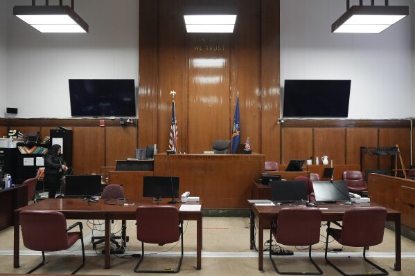 FILE - Judge Juan Merchan's courtroom sits empty between proceedings, March 12, 2024, in New York. Former President Donald Trump’s history-making criminal trial is set to start Monday, April 15, with a group of 12 jurors and six alternates chosen to decide whether Trump is guilty of a crime. The idea is to get people who are willing to put their personal opinions aside and make a decision based on the evidence. (AP Photo/Seth Wenig, File)