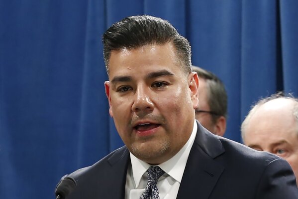 FILE — In this Tuesday, Feb. 18, 2020 file photo is California Insurance Commissioner Ricardo Lara at a state Capitol news conference in Sacramento, Calif. On Monday, April 13, 2020, Lara ordered some companies to refund insurance premiums for March and April because of the coronavirus. The directive includes workers compensation, medical malpractice and private and commercial auto policies. (AP Photo/Rich Pedroncelli, File)