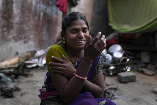 Penupothula Ratnam, a daily wage shrimp worker, talks about her day-to-day struggles, at her residence in Bhogapuram, Kakinada district, Andhra Pradesh, India, Saturday, Feb. 10, 2024. “It’s not enough for our living.” Rarely does she get a day off, she says. (AP Photo/Mahesh Kumar A.)