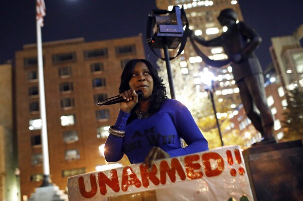 Tawanda Jones leads a vigil outside of Baltimore City Hall on Oct. 21, 2015, for her brother, Tyrone West, who died during an encounter with police. (AP Photo/Patrick Semansky, File)
