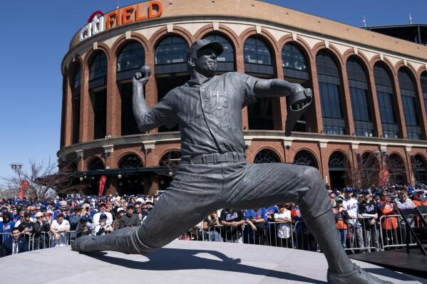 A statue of the late New York Mets player Tom Seaver is revealed outside CitiField before a baseball game between the New York Mets and the Arizona Diamondbacks, Friday, April 15, 2022, in New York. (AP Photo/John Minchillo)
