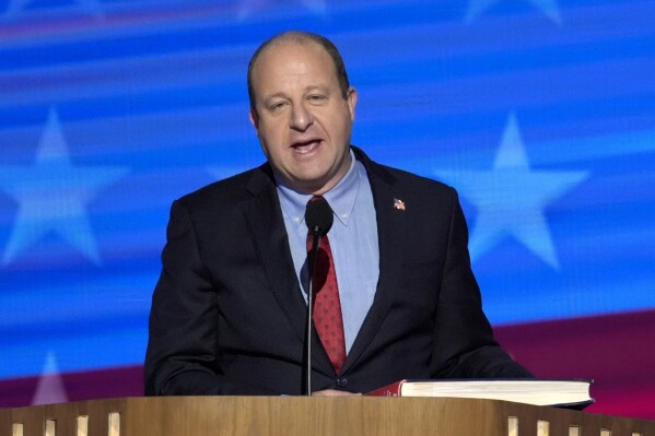 Colorado Gov. Jared Polis speaks during the Democratic National Convention, Aug. 21, 2024, in Chicago. (AP Photo/J. Scott Applewhite, File)