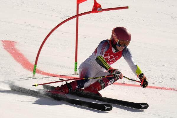 Mikaela Shiffrin of United States races during the mixed team parallel skiing event at the 2022 Winter Olympics, Sunday, Feb. 20, 2022, in the Yanqing district of Beijing. (AP Photo/Luca Bruno)