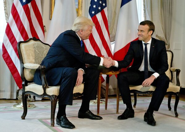 
              U.S. President Donald Trump shakes has with French President Emmanuel Macron at the top of a meeting at the U.S. ambassador's residence in Brussels, Thursday, May 25, 2017. World leaders, including French President Emmanuel Macron and US President Donald Trump are in Belgium to attend a NATO summit. (AP Photo/Peter Dejong, Pool)
            