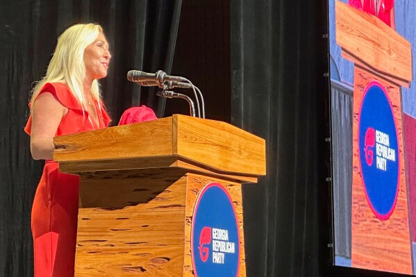 U.S. Rep. Marjorie Taylor Greene, R-Ga., speaks to delegates at the Georgia Republican Convention in Dalton, Ga., Saturday, June 7, 2025. (AP Photo/Jeff Amy)