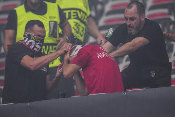 Nice supporters beat a FC Koln supporters during clashes prior to the start of the Europa Conference League Group D match between Nice and FC Koln at the Allianz Riviera stadium in Nice, France, Thursday, Sept. 8, 2022. (AP Photo/Daniel Cole)