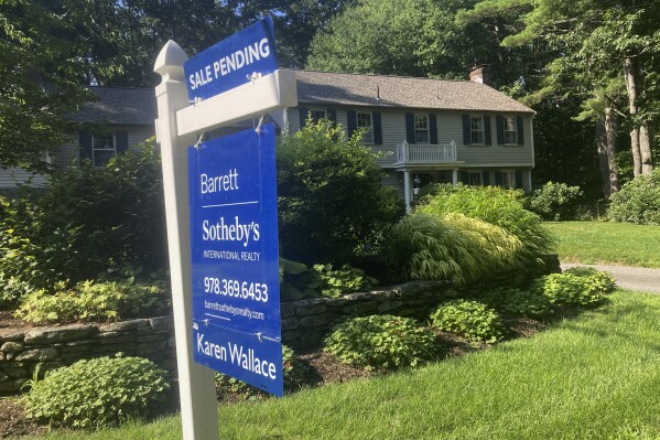 A sign noting a pending sale is shown in front of a home on Sunday, Aug. 20, 2023, in Concord, Mass. On Tuesday, Aug. 22, 2023, the National Association of Realtors reports on sales of existing homes in July. (AP Photo/Peter Morgan)