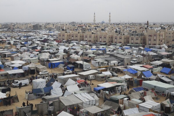 A tent camp housing Palestinians displaced by the Israeli offensive is seen in Rafah, Gaza Strip, Tuesday, Feb. 27, 2024. (AP Photo/Hatem Ali)