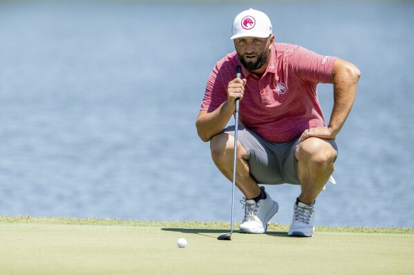 Captain Jon Rahm, of Legion XIII GC, lines up a putt on the seventh green during the first round of LIV Golf Miami at Trump National Doral, Friday, April 5, 2024, in Miami. (Charles Laberge/LIV Golf via AP)