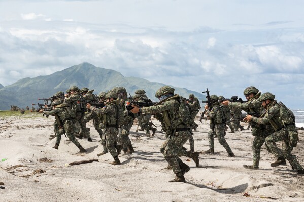 In this photo released by Australian Department of Defense via Australian Embassy in the Philippines, Armed Forces of the Philippines soldiers are partaking in a large-scale combined amphibious assault exercise on Friday, Aug. 25, 2023, at a naval base in San Antonio, Zambales, Philippines. The Philippines and Australia, while also backed by the United States Marine Corps, are holding a bilateral amphibious training called 