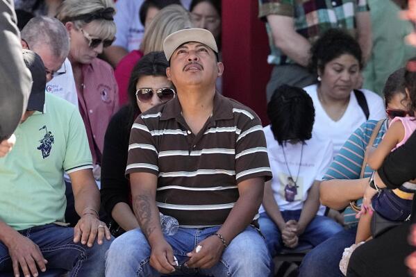 Mass shooting survivor Wilson Garcia looks up to the sky during a vigil for his son, Daniel Enrique Laso, 9, Sunday, April 30, 2023, in Cleveland, Texas. Garcia's son and wife were among the five people killed in a mass shooting last week when the suspected gunman, Francisco Oropeza, allegedly shot his neighbors after they asked him to stop firing off rounds in his yard. (AP Photo/David J. Phillip)