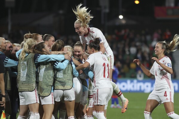 Denmark players celebrate their victory at the Women's World Cup Group D soccer match between Haiti and Denmark in Perth, Australia, Tuesday, Aug. 1, 2023. (AP Photo/Gary Day)