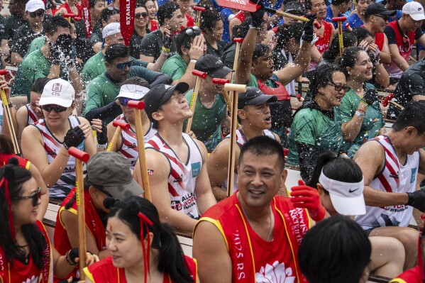 Competitors take part in the Stanley International Dragon Boat Championships to celebrate the Dragon Boat Festival in Hong Kong, Saturday, May 31, 2025. (AP Photo/Chan Long Hei)