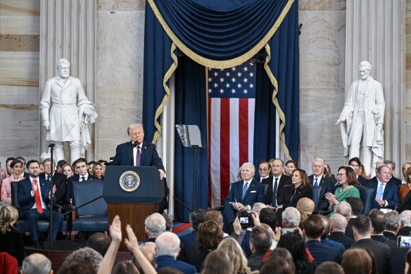 President Donald Trump, center, takes part in a signing ceremony in the President's Room after the 60th Presidential Inauguration, Monday, Jan. 20, 2025, at the U.S. Capitol in Washington. (Melina Mara/The Washington Post via AP, Pool)