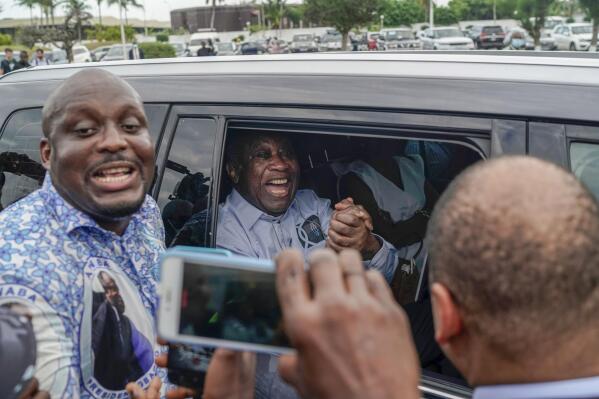 Former Ivorian president Laurent Gbagbo arrives at the international airport, in Abidjan, Ivory Coast, Thursday, June 17, 2021.  After nearly a decade, Gbagbo returns to his country following his acquittal on war crimes charges was upheld at the International Criminal Court earlier this year. (AP Photo/Leo Correa)
