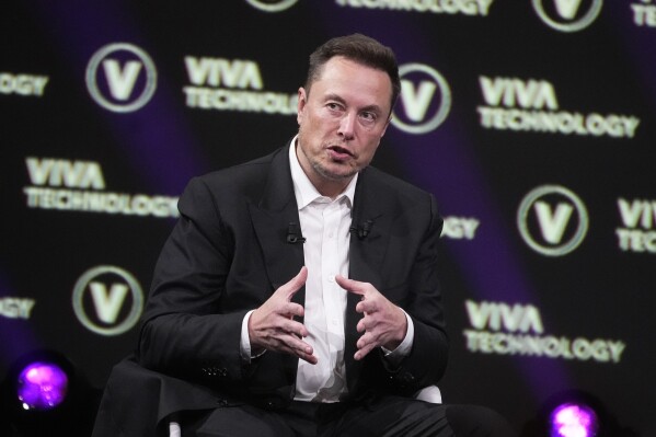 FILE - Elon Musk, who owns Twitter, Tesla and SpaceX, speaks at the Vivatech fair, June 16, 2023, in Paris. Elon Musk鈥檚 social media platform X has begun charging a $1 fee to new users in the Philippines and New Zealand. It's a test designed to cut down on the spam and fake accounts flourishing on the platform. (APPhoto/Michel Euler, File)