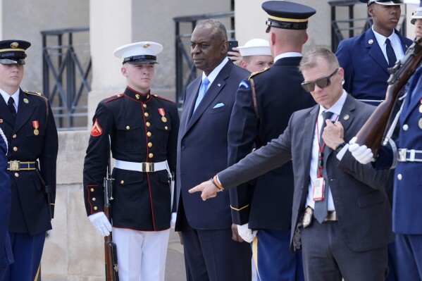 Defense Secretary Lloyd Austin, third left, stands before greeting Kenya's President William Ruto, not pictured, at the Pentagon in Washington, Friday, May 24, 2024. (AP Photo/Susan Walsh)