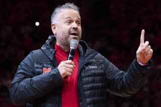 FILE - Nebraska's head football coach Matt Rhule speaks to fans at halftime during an NCAA college basketball game between Purdue and Nebraska, Saturday, Dec. 10, 2022, in Lincoln, Neb. Rhule has endeared himself to Nebraska's ardent fans, telling them what they want to hear when he says he wants to adopt the program's traditional staples of hard work, physical practices and a pounding run game. (Kenneth Ferriera/Lincoln Journal Star via AP, File)