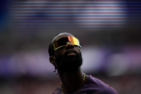 Freddie Crittenden, of the United States, competes during a heat in the men's 110-meter hurdles at the 2024 Summer Olympics, Sunday, Aug. 4, 2024, in Saint-Denis, France. (AP Photo/Petr David Josek)