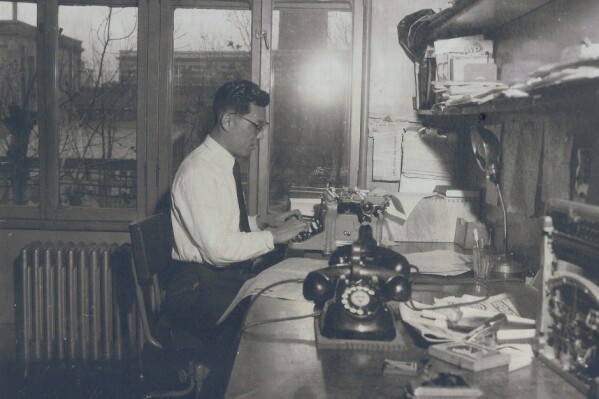 In this undated photo provided by the Hwang family, K.C. Hwang is seen working in the bureau. K.C. Hwang, whose six-decade-long journalism career included 30 years chronicling South Korea’s tumultuous modern history as Seoul bureau chief for The Associated Press, has died on Thursday, Aug. 31, 2023. He was 99. (Hwang Family handout via AP)