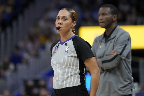 FILE - Referee Sha'Rae Mitchell during an NBA basketball game between the Golden State Warriors and the Detroit Pistons in San Francisco, Wednesday, Jan. 4, 2023. The NBA has promoted Intae Hwang and Sha’Rae Mitchell to its full-time referee staff for the coming season. Mitchell refereed 11 games as a non-staff official last season, and has also worked in the G League and WNBA. (AP Photo/Jeff Chiu, File)