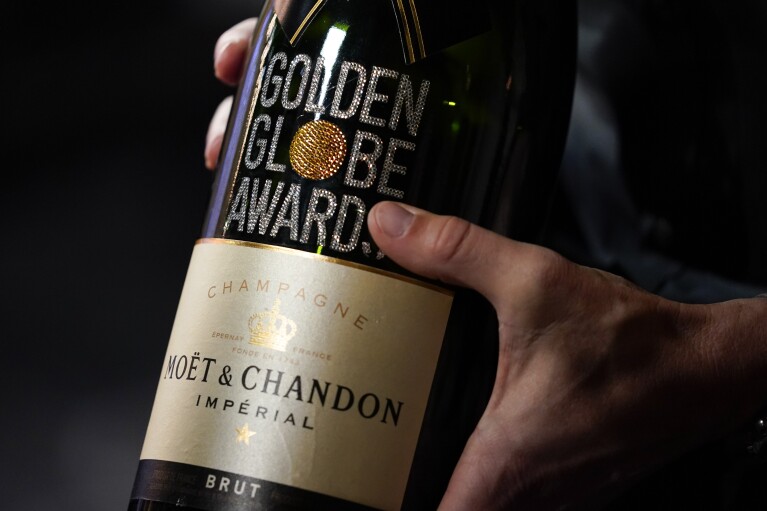 A bottle of champagne is presented during the Golden Globe Awards Press Preview at the Beverly Hilton on Thursday, Jan. 4, 2024, in Beverly Hills, Calif. (AP Photo/Ashley Landis)