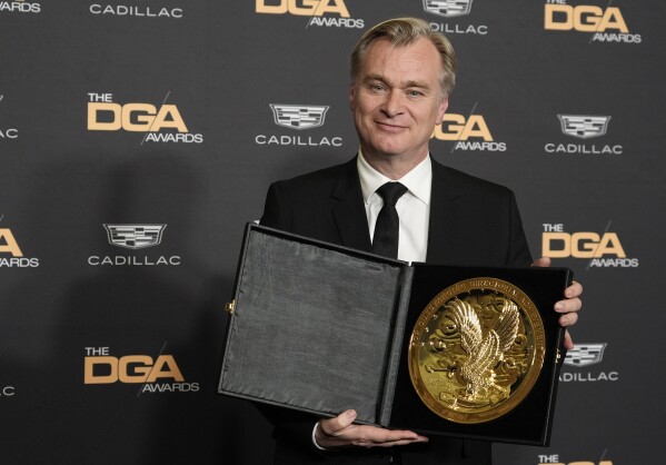 Christopher Nolan, director of the film "Oppenheimer," poses with his DGA Award for Theatrical Feature Film backstage at the 76th DGA Awards, Saturday, Feb. 10, 2024, in Beverly Hills, Calif. (AP Photo/Chris Pizzello)