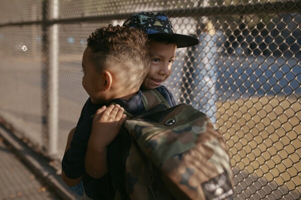 FILE - Damien Salinas, 5 years old, right, hugs a friend as he arrives to school, Sept. 7, 2023, in New York. Seventy years after the Supreme Court's Brown v. Board, America is both more diverse — and more segregated. (AP Photo/Andres Kudacki, File)