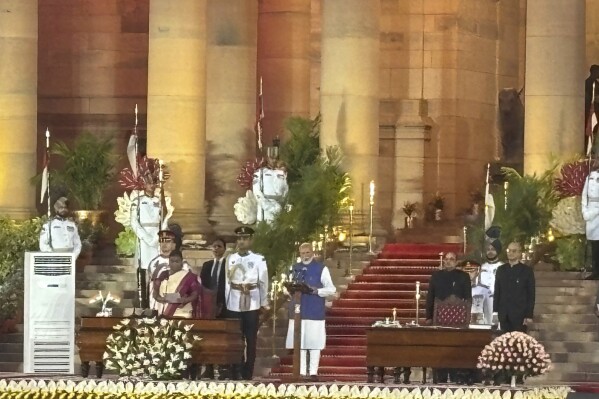 Narendra Modi, center, takes oath as the Prime Minister of India at the Rashtrapati Bhawan, in New Delhi, India, Sunday, June 9, 2024. The 73-year-old leader is only the second Indian prime minister to retain power for a third term. (AP Photo/Manish Swarup)