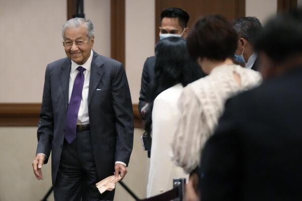 Malaysia's former Prime Minister Mahathir Mohamad walks after speaking at a session of the International Conference on "The Future of Asia" Friday, May 27, 2022 in Tokyo. (AP Photo/Eugene Hoshiko)