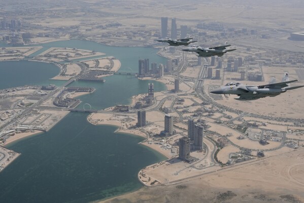 Qatar Emiri Air Force F-15s provide an honorary escort for Air Force One, carrying President Donald Trump, as it arrives in Doha, Qatar, Wednesday, May 14, 2025. (AP Photo/Alex Brandon)