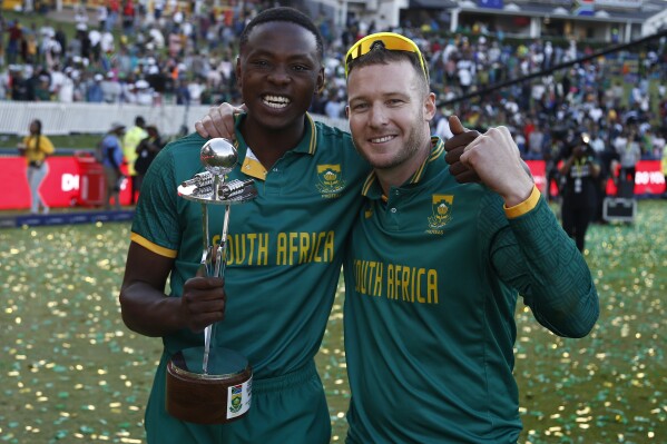 South African's Kagiso Rabada, left, and David Miller celebrate after 3-2 series win against Australia at the Wanderers Stadium in Johannesburg, South Africa, Sunday, Sept. 17, 2023. (AP Photo)