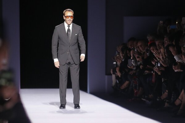 Fashion designer Tom Ford appears on the runway after showing his latest collection during Fashion Week, Thursday Feb. 8, 2018, in New York. (AP Photo/Bebeto Matthews)