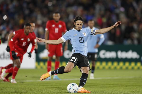 FILE - Uruguay's Edinson Cavani kicks a penalty shot and scores during a friendly soccer match against Panama at Centenario Stadium in Montevideo, Uruguay, Saturday, June 11, 2022. Cavani is back scoring again and that's good news for Uruguay ahead of potentially his last World Cup. The 35-year-old striker moved to Valencia in the search for playing time ahead of the tournament in Qatar but failed to score in his first three games with the club. (AP Photo/Matilde Campodonico, File)