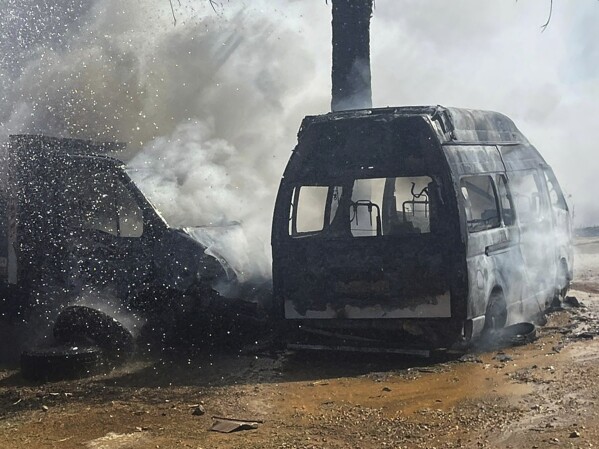 A truck and ambulance burn after Israeli airstrikes hit a group of paramedics outside a hospital in Marjayoun, south Lebanon, Friday, Oct. 4, 2024. (AP Photo)
