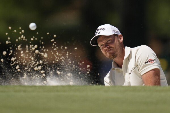 Danny Willett, of England, hits from the bunker on the seventh hole during second round at the Masters golf tournament at Augusta National Golf Club Friday, April 12, 2024, in Augusta, Ga. (AP Photo/Ashley Landis)