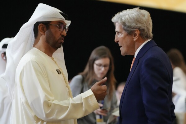 COP28 President Sultan al-Jaber, left, and John Kerry, U.S. Special Presidential Envoy for Climate, speak as they attend a meeting at the COP28 U.N. Climate Summit, Sunday, Dec. 10, 2023, in Dubai, United Arab Emirates. (AP Photo/Peter Dejong)