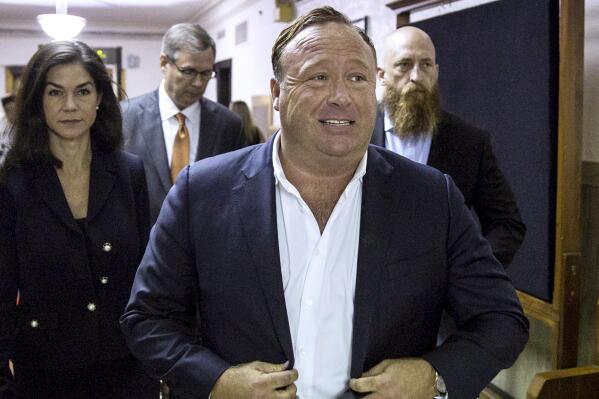 FILE - In this April 17, 2017, file photo, "Infowars" host Alex Jones arrives at the Travis County Courthouse in Austin, Texas. Lawyers for relatives of Sandy Hook Elementary School shooting victims asked a judge Wednesday, March 23, 2022, to order Infowars host Jones to appear at a deposition and have him arrested if he doesn't, after Jones failed to show up at the proceeding after citing undisclosed medical conditions. (Tamir Kalifa/Austin American-Statesman via AP, File)