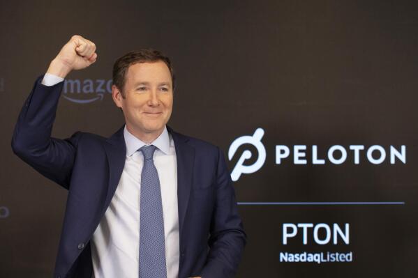 FILE - Peloton CEO John Foley celebrates at the Nasdaq MarketSite before the opening bell and his company's IPO, Sept. 26, 2019 in New York. Activist investor Blackwells Capital is asking Peloton to remove CEO John Foley and consider selling the company just a few days after a media report said the exercise and treadmill company was temporarily halting production of its connected fitness products amid waning consumer demand. (AP Photo/Mark Lennihan, file)
